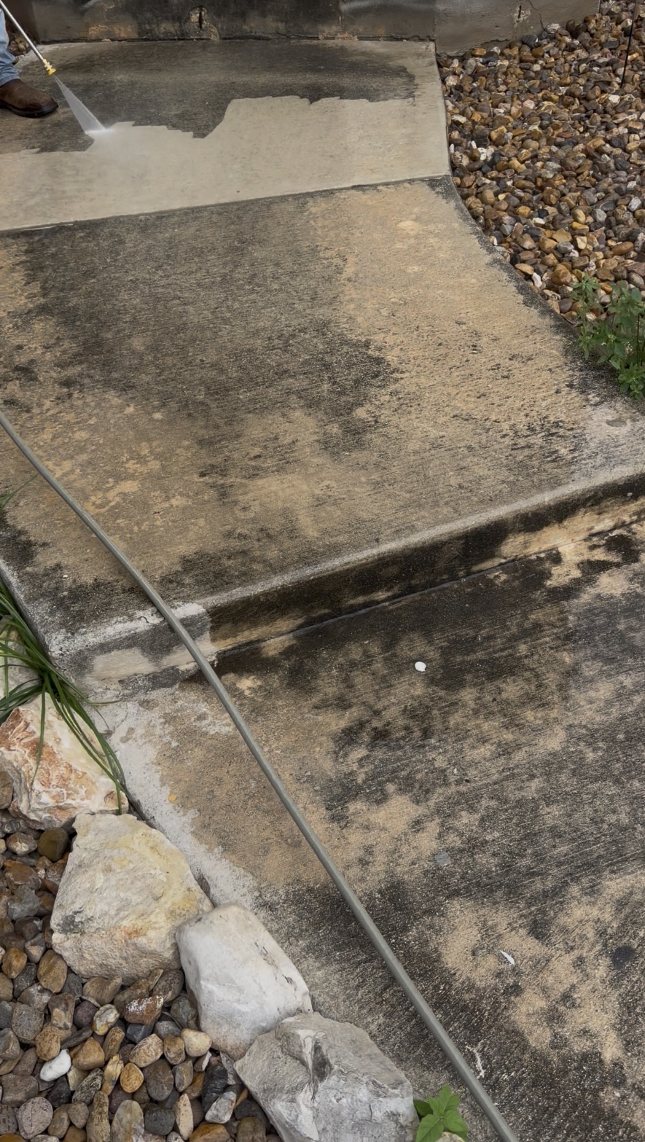 Power washing concrete walkway