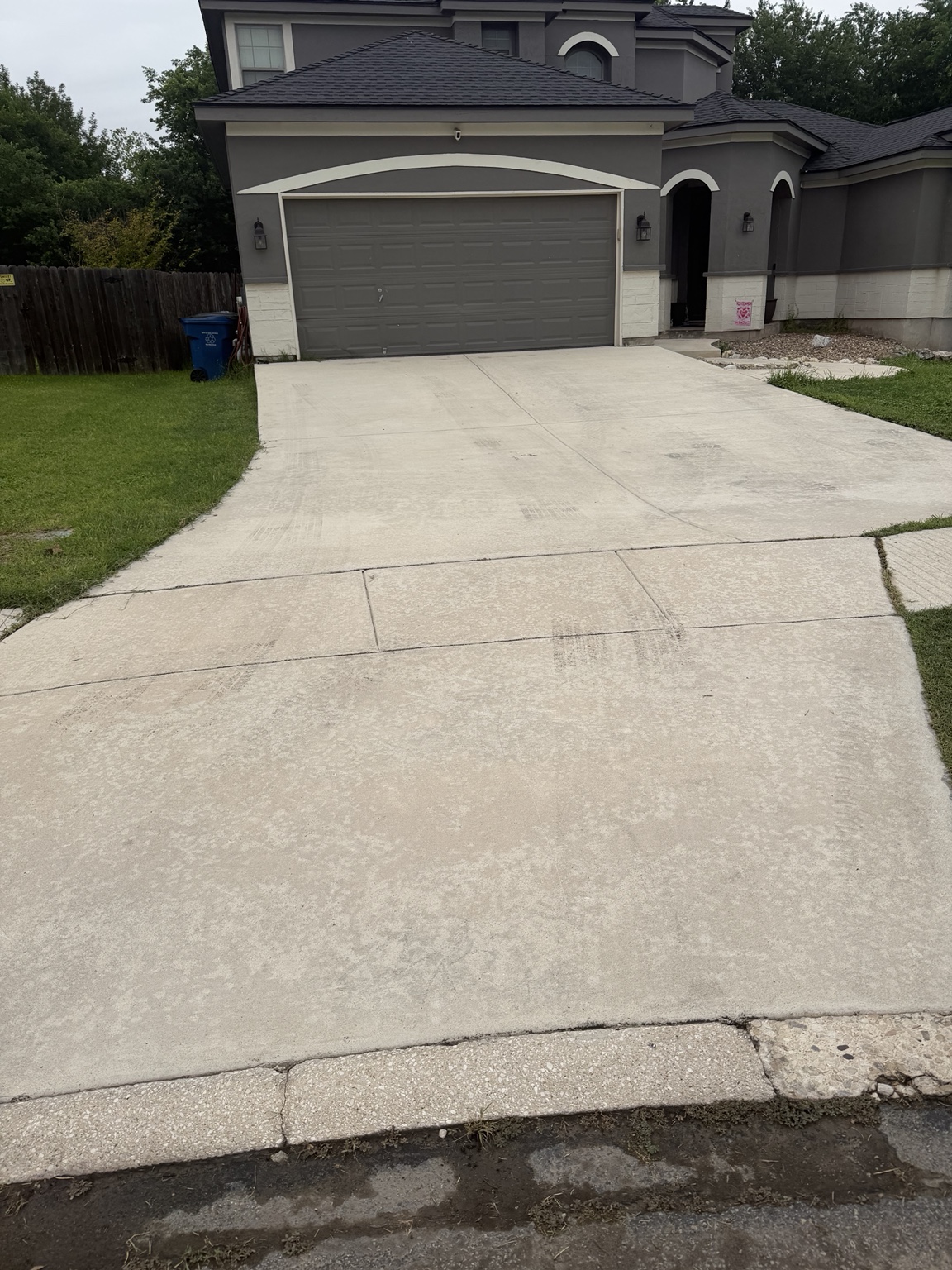 Clean driveway after power washing